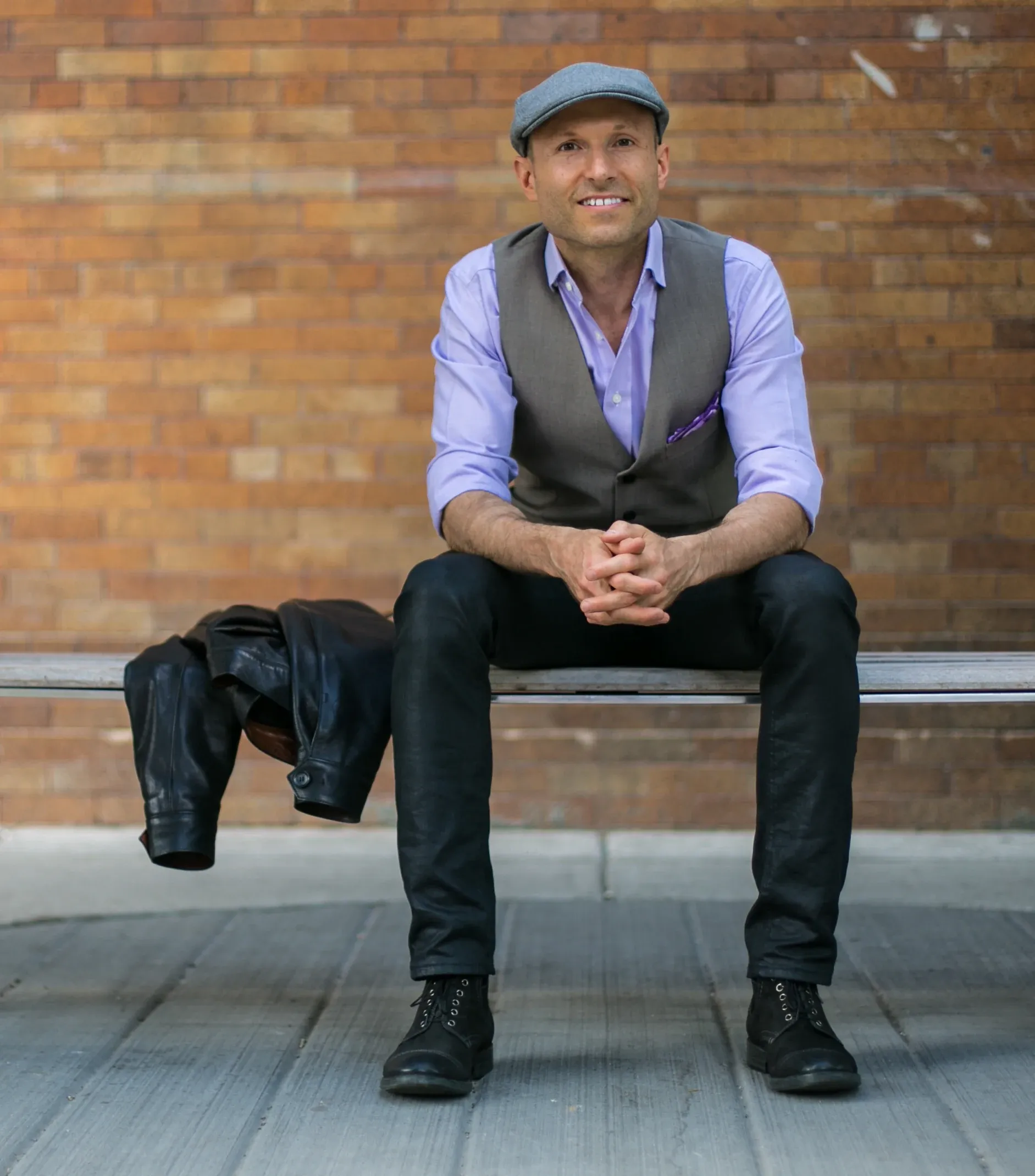 Burton Campbell, Founder of Werk One, seated on a bench